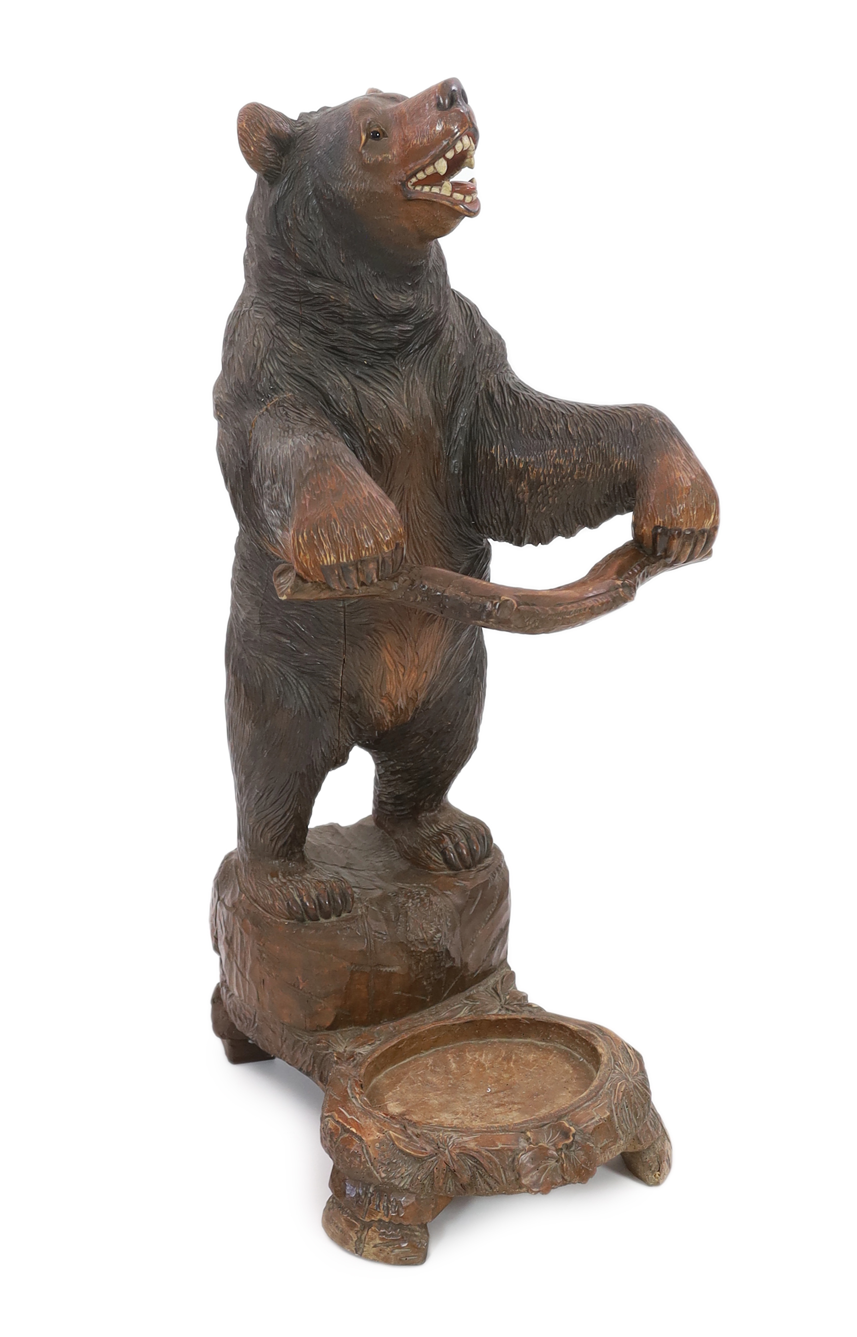 A late 19th century Black Forest carved wood bear stick stand